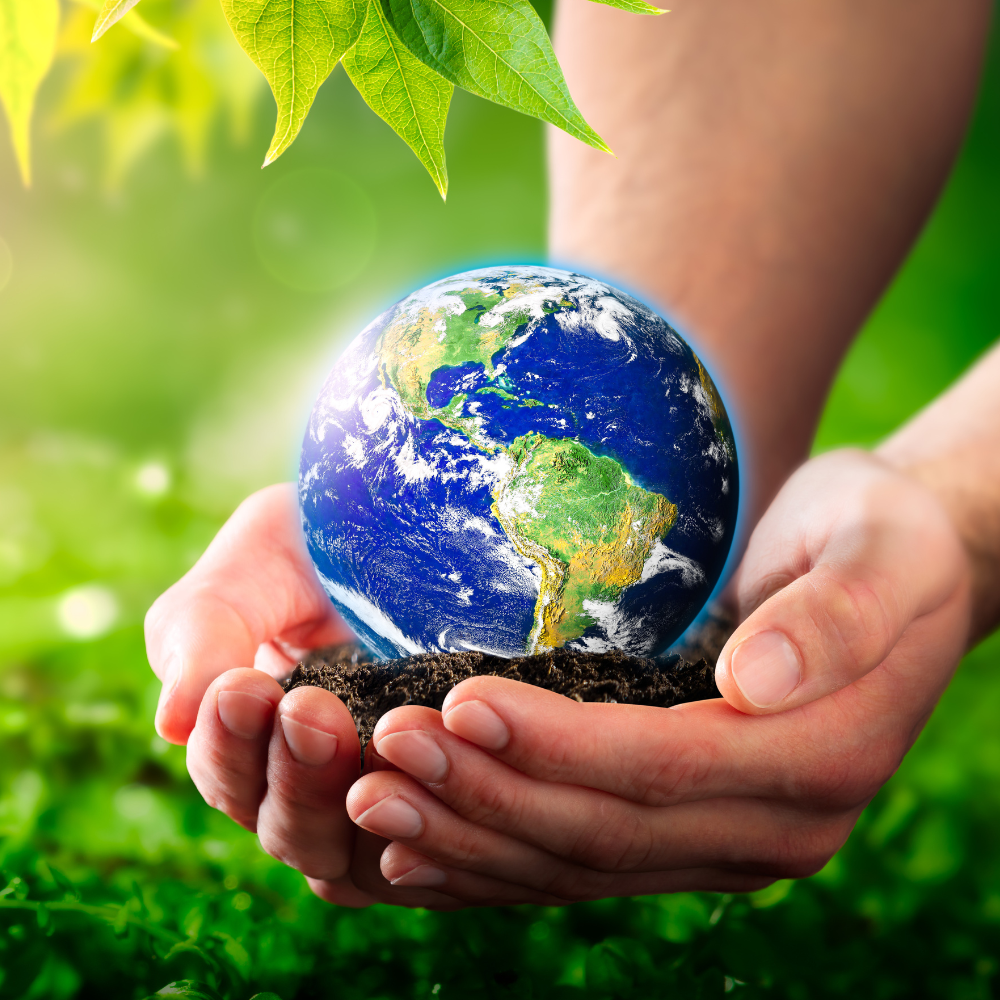 The earth being lovingly cradled in someone's hands to protray love of our only planet.